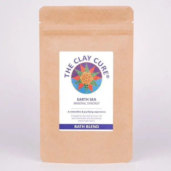 Brown paper pouch of The Clay Cure Earth Sea Mineral Synergy Bath Blend, featuring a colourful mandala design on the label.